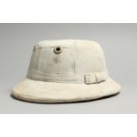 A WHITE POLO PITH HELMET.