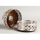 A PAIR OF PLATE SILVER AND WOOD CIRCULAR WINE COASTERS 5ins diameter.