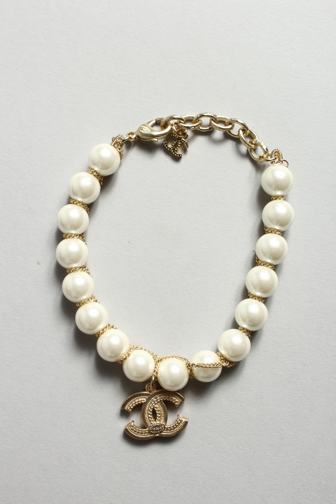 A CHANEL STYLE PEARL AND ENTWINED C BRACELET in a Chanel box - Image 2 of 6