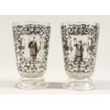 A GOOD PAIR OF BOHEMIAN GLASS TWELVE SIDED BEAKERS, painted with Turkish figures, scrolls and birch.