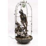 A FINE BRONZED WATER FEATURE, a classical female and Cupid standing on a metal base and arbour.