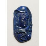 A CARVED LAPIS PENDANT