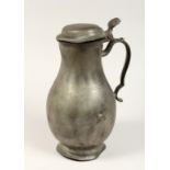A FRENCH PEWTER LIDDED JUG 11ins high.