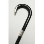 AN EBONY SILVER MOUNTED WALKING STICK, LONDON 1933. 36ins long.