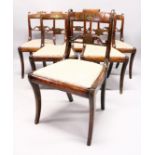 A SET OF SIX REGENCY ROSEWOOD BRASS INLAID SINGLE CHAIRS with drop in seats and sabre legs