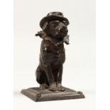 A GOOD SMALL BRONZE DOG INKWELL on a square base. 4ins high.