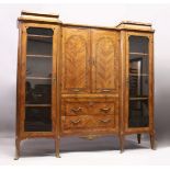 A GOOD LARGE FRENCH KINGWOOD CABINET, formed as a pair of central marquetry panel doors, over a