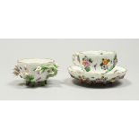 TWO MEISSEN PORCELAIN CUPS AND SAUCERS AND A SAUCER, encrusted with flowers and painted with