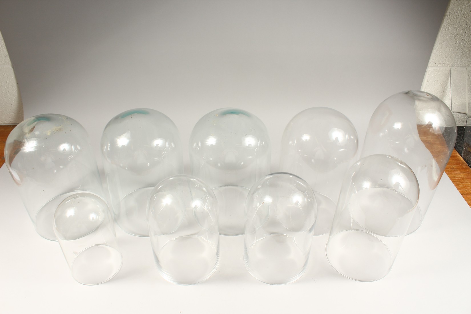 A COLLECTION OF 9 GLASS DOMES. 14ins to 8ins high. - Image 4 of 4