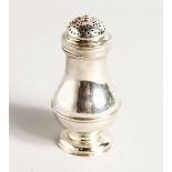 A GEORGE II SILVER PEPPER with crest. 4ins high London 1736, maker George Jones