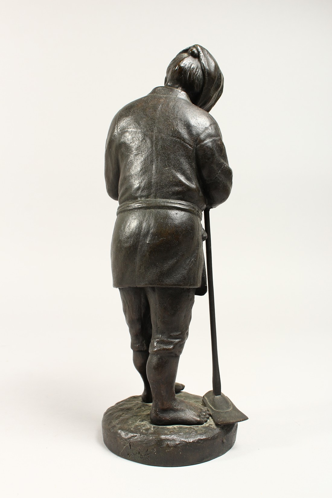 A JAPANESE BRONZE STANDING FIGURE OF A MAN holding a pipe and shovel. 12ins high. - Image 3 of 5