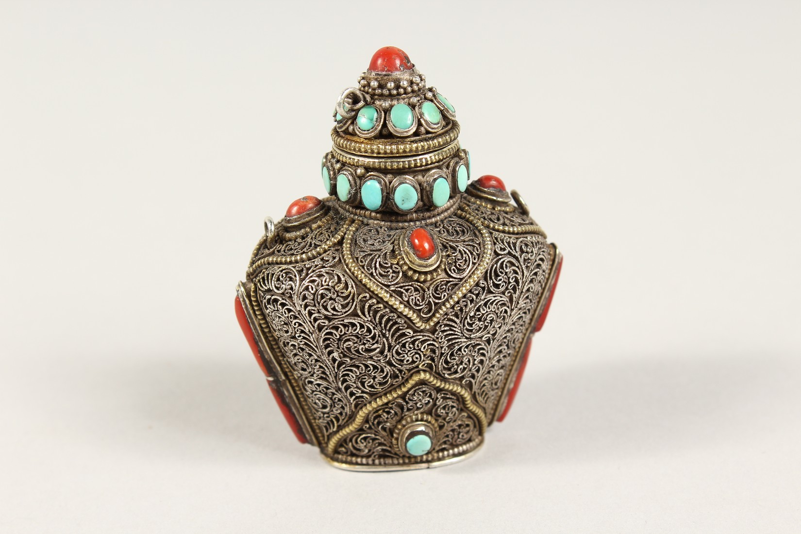 AN ISLAMIC FILIGREE SILVER SCENT BOTTLE with coral and turquoise stones. 2.5ins - Image 2 of 6