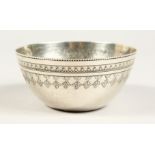 AN ISLAMIC ENGRAVED CIRCULAR SILVER BOWL