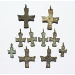 TEN SMALL METAL ROMAN CROSSES. 2-3ins long