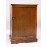 A GOOD EDWARDIAN OAK CASED COLLECTION CABINET with panel door enclosing 11 glass top drawers with