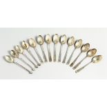 A SET OF TEN VICTORIAN SILVER COFFEE SPOONS with shell bowl. London 1891 and four odd spoons (14)
