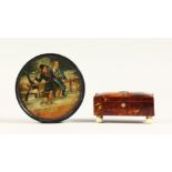 A SMALL TORTOISESHELL CASKET on ivory bun feet and a circular papier mache snuff box. 3ins (2)