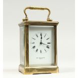 A FRENCH BRASS CARRIAGE CLOCK retailed by MALLETT & SON, BATH. 5.25ins high The reverse stamped EGL.