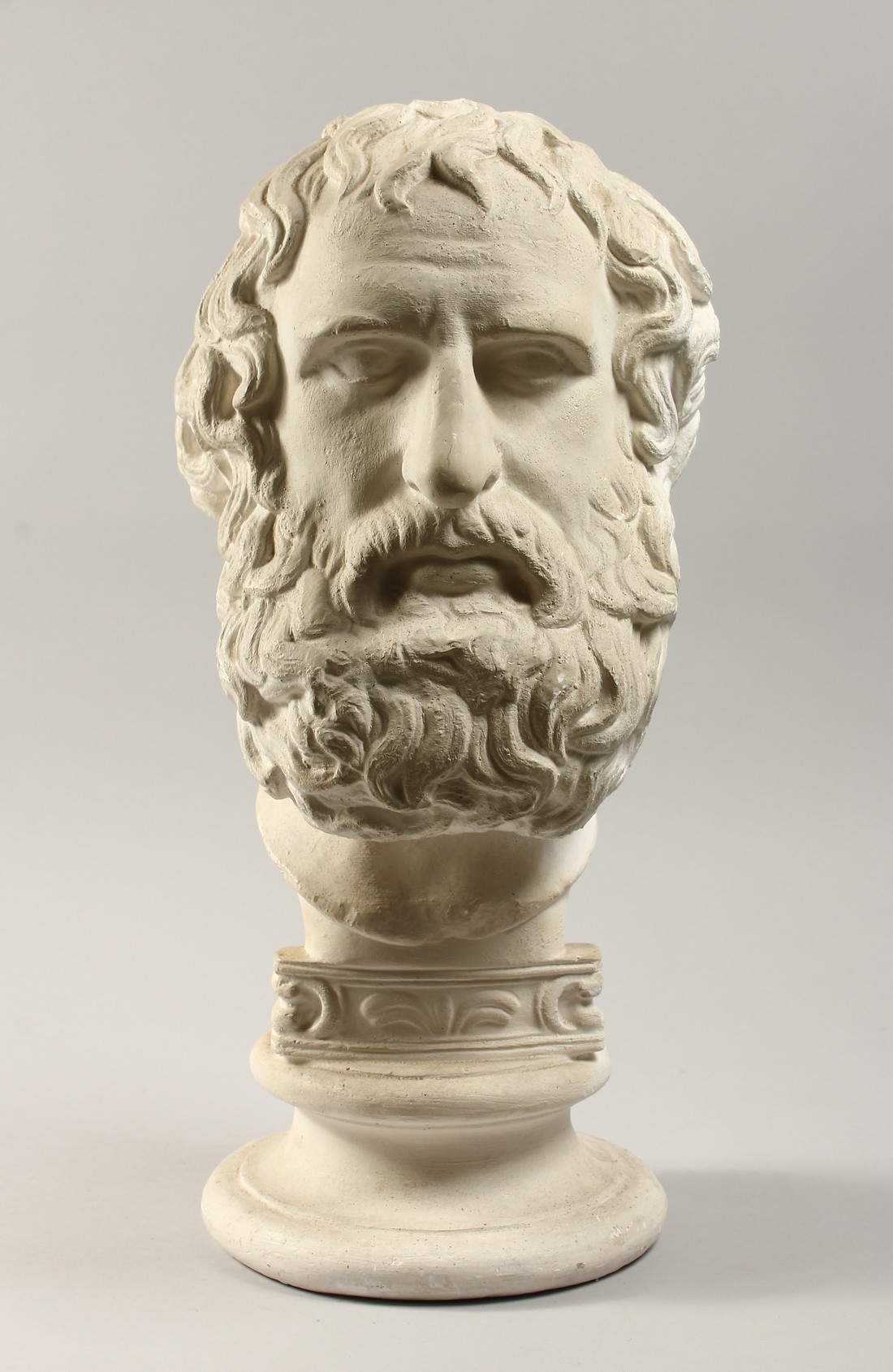 AN ANTIQUE PLASTER BUST 19ins high.