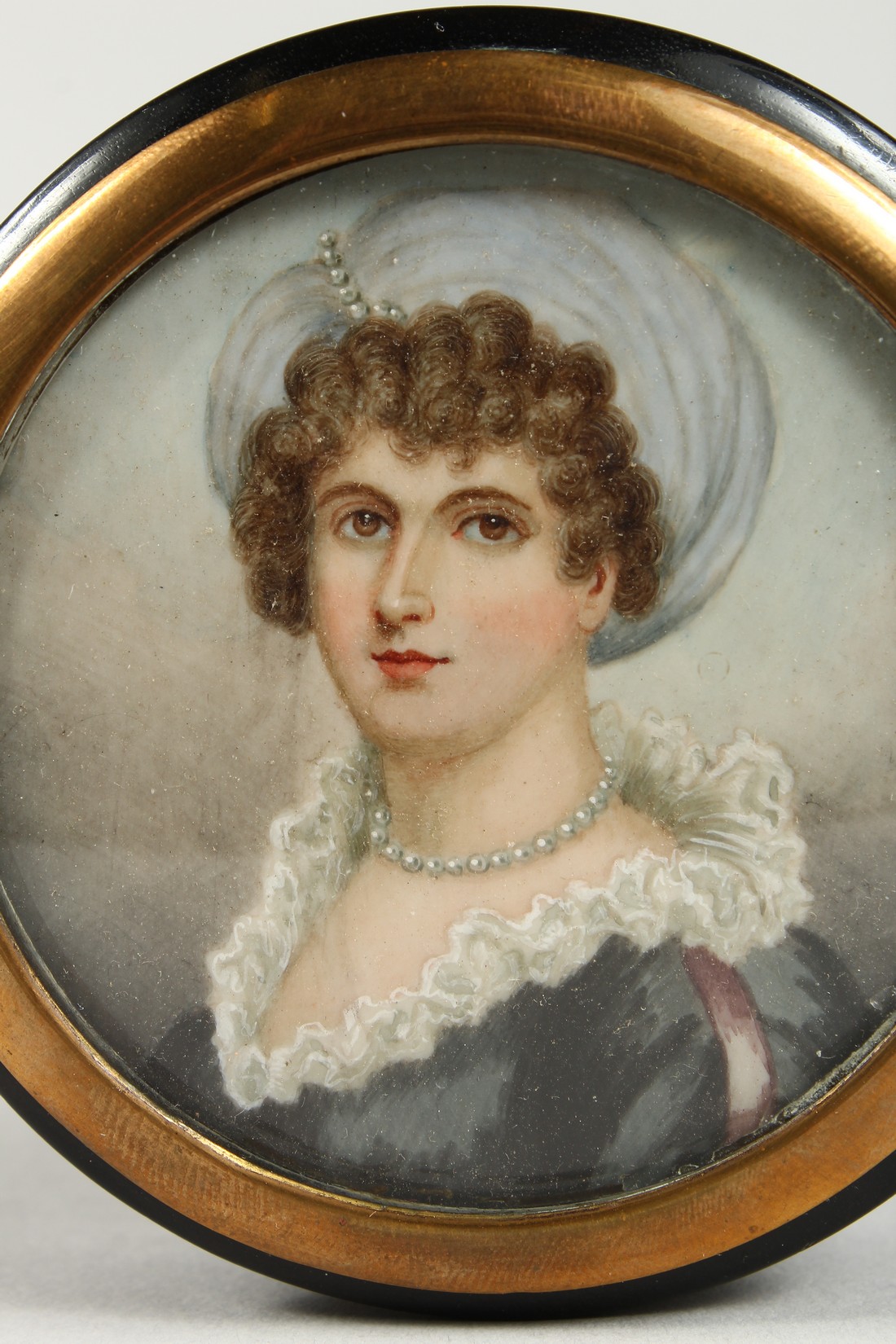 A GEORGIAN EBONY CIRCULAR BOX, the top painted with a portrait of a young lady wearing pearls. - Image 2 of 5