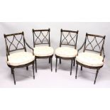 A SET OF FOUR BLACK AND GILT CHAIRS, two with arms, with cross fret backs and cane seats.
