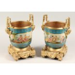 A GOOD PAIR OF ORMOLU AND PORCELAIN SEVRES DESIGN CIRCULAR CACHE POTS painted with classical