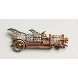 A GOLD DIAMOND SET VINTAGE CAR BROOCH 1.75ins long (one wheel missing)