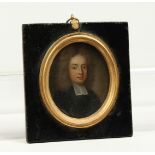 A SMALL 18TH CENTURY OVAL MINIATURE OF A CLERK, on copper. 2ins x 1.75ins