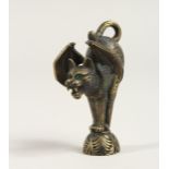 A BRONZE PIPE TAMPER as a cat snarling cat with bat's wings 2.5ins