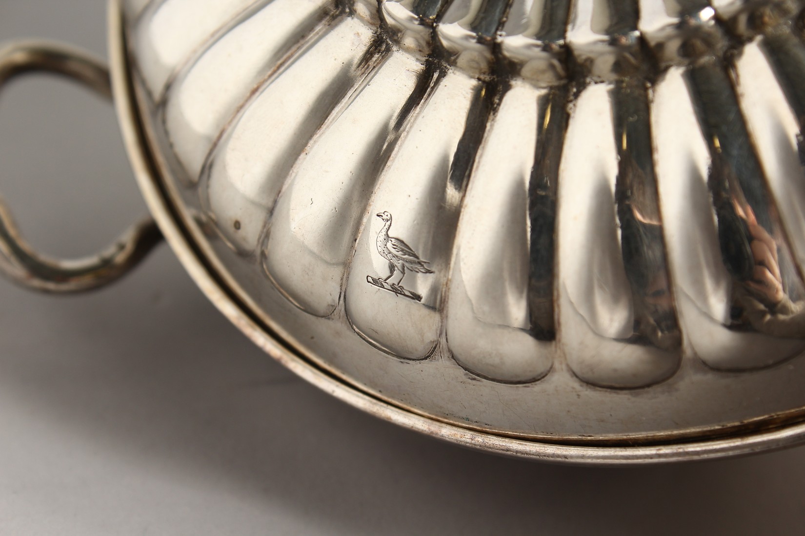 A GEORGE II SILVER CIRCULAR TWO HANDLED ECULLE and cover with fluted decorations. 5.5ins diameter - Image 2 of 7