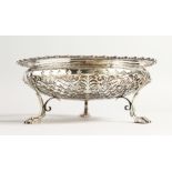 A JAMES DIXON AND SONS SILVER CIRCULAR PIERCED FRUIT BOX on three claw feet 8ins diameter