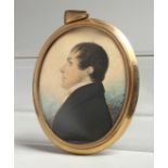 AN EARLY VICTORIAN OVAL MINIATURE OF A GENTLEMAN in a gilt frame. 2.25ins x 1.75ins