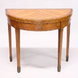 A GEORGE III SATINWOOD HALF MOON CARD TABLE with crossbanded folding top, beige cover on tapering