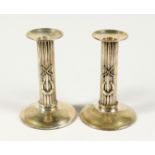 A PAIR OF POLO PRESENTATION CANDLESTICKS, 'To William Reddaway From The Delhi Polo Club', with cross