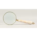 A MAGNIFYING GLASS with a mother of pearl handle.