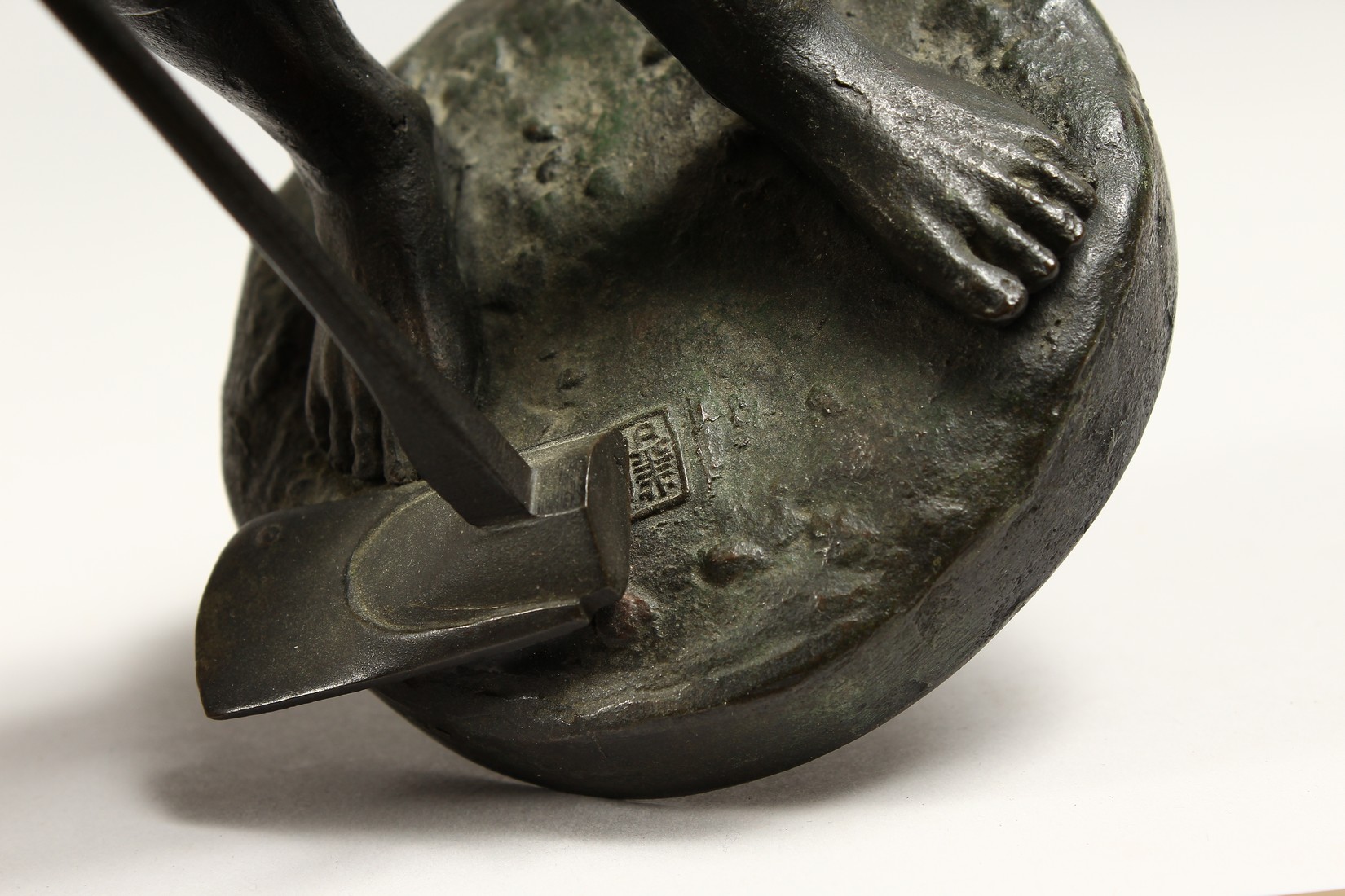 A JAPANESE BRONZE STANDING FIGURE OF A MAN holding a pipe and shovel. 12ins high. - Image 4 of 5