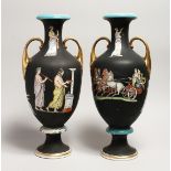A PAIR OF CLASSICAL TWO HANDLED VASES with Greek figures 16ins high.