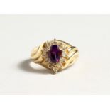 A 14CT GOLD, AMETHYST AND DIAMOND TEAR DROP RING