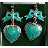 A PAIR OF SILVER AND ENAMEL BOW AND HEART EARRINGS
