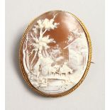 A LARGE 18CT GOLD OVAL CAMEO BROOCH, landscape, horse drawn cart.