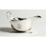 A SMALL EDWARD VII SAUCE BOAT on three pad feet. Chester 1907. 14.5cm long - 96g