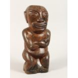 A CARVED WOOD POLYNESIAN FIGURE 18ins high