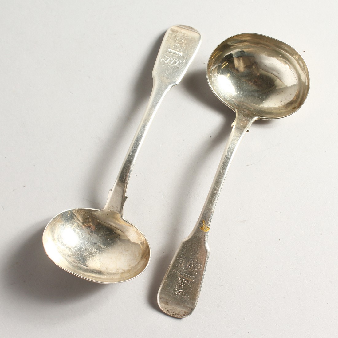 A PAIR OF SILVER FIDDLE PATTERN SAUCE LADLES, Chester 1838 Maker John Sutters