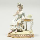 A GOOD MEISSEN PORCELAIN GROUP 'SENSE AND SMELL', a young lady sitting beside a table smelling