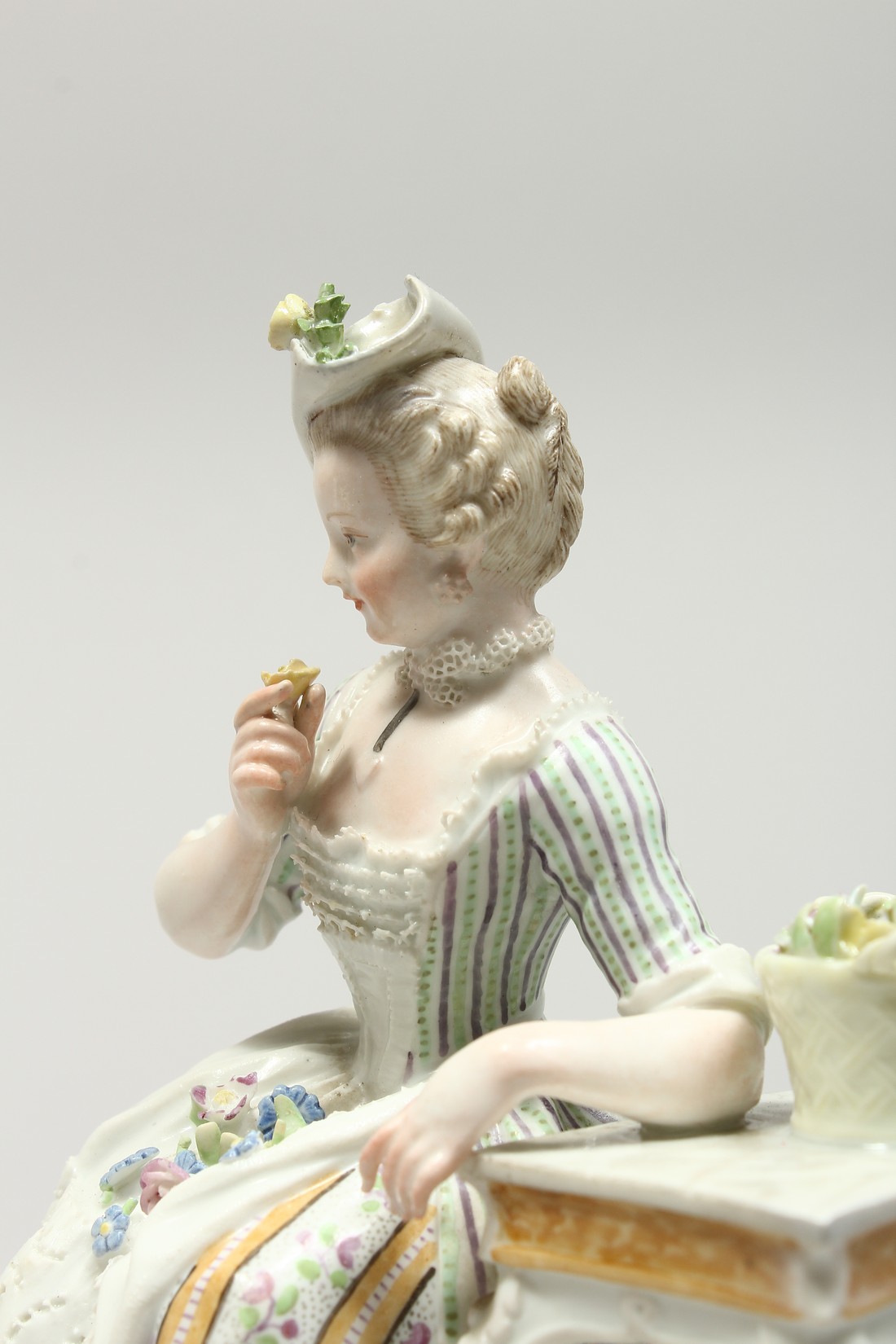 A GOOD MEISSEN PORCELAIN GROUP 'SENSE AND SMELL', a young lady sitting beside a table smelling - Image 2 of 13