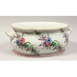 A LARGE VICTORIAN TWO HANDLED RECTANGULAR FOOT BATH painted with corn flowers . 19ins long 8ins
