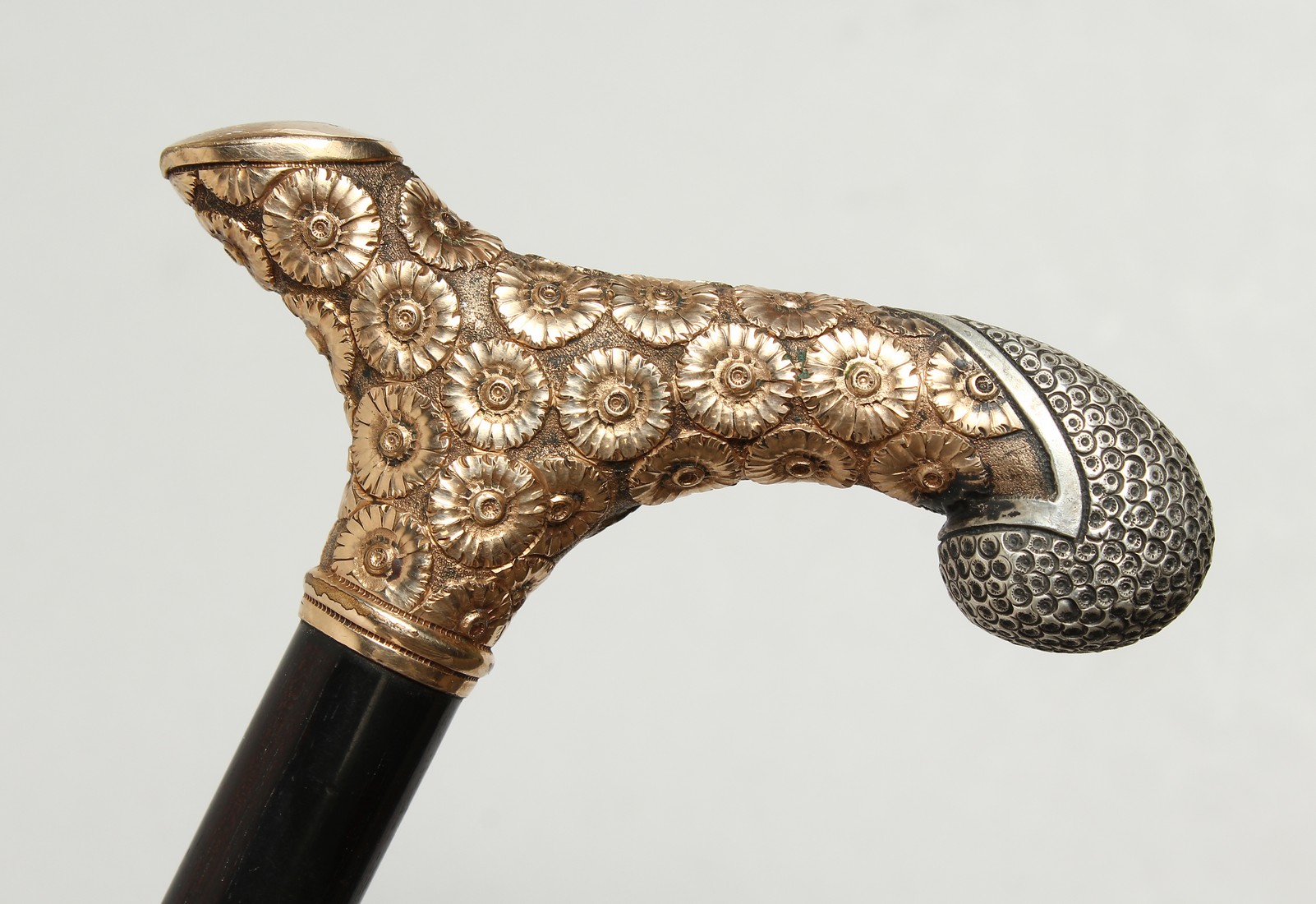 A GOOD EBONY WALKING CANE with silver and silver gilt handle. 36ins long.