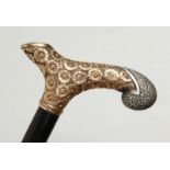 A GOOD EBONY WALKING CANE with silver and silver gilt handle. 36ins long.