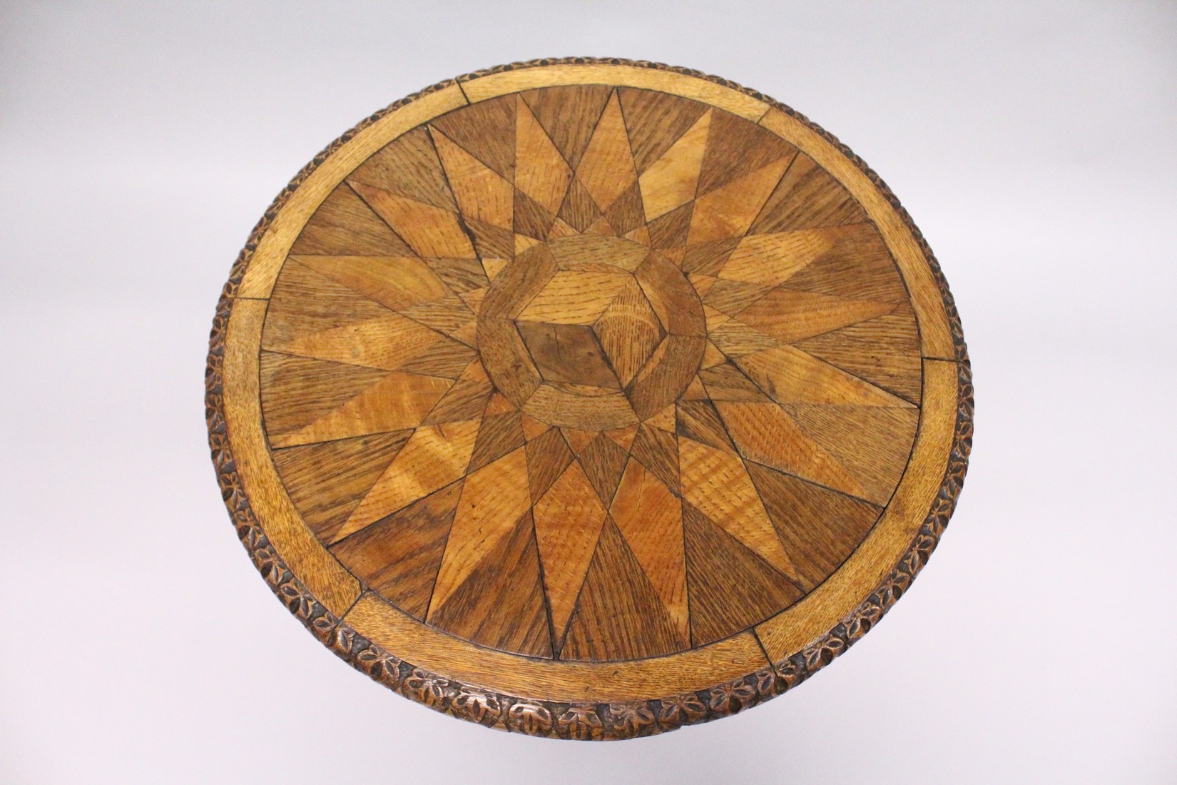 A 19TH CENTURY CIRCULAR TABLE, the star top inlaid with specimen woods on a fluted pillar and - Image 2 of 4