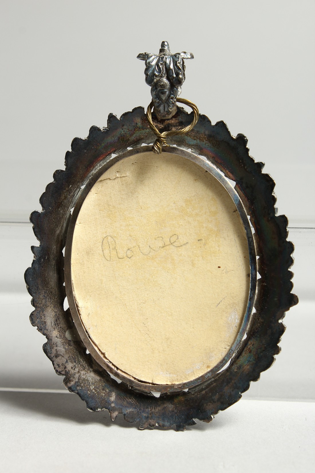 A GEORGIAN OVAL MINIATURE OF A YOUNG MAN, in a silver frame. 2.5ins x 2ins. - Image 3 of 3